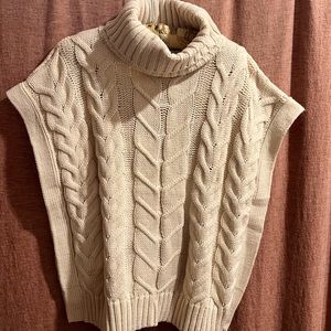 Cream colored woven poncho